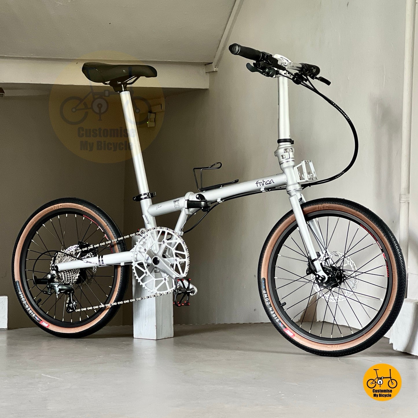 Sleek space silver foldable bike ready to ride