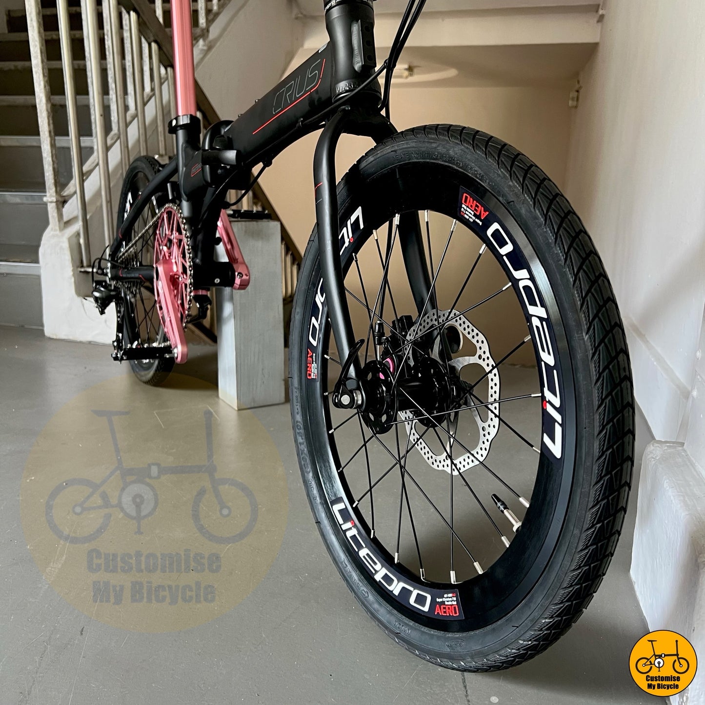 Entry-level black pink folding bike with good components
