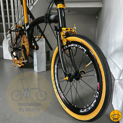 Crius Trifold 18-inch folding bike with black and gold frame
