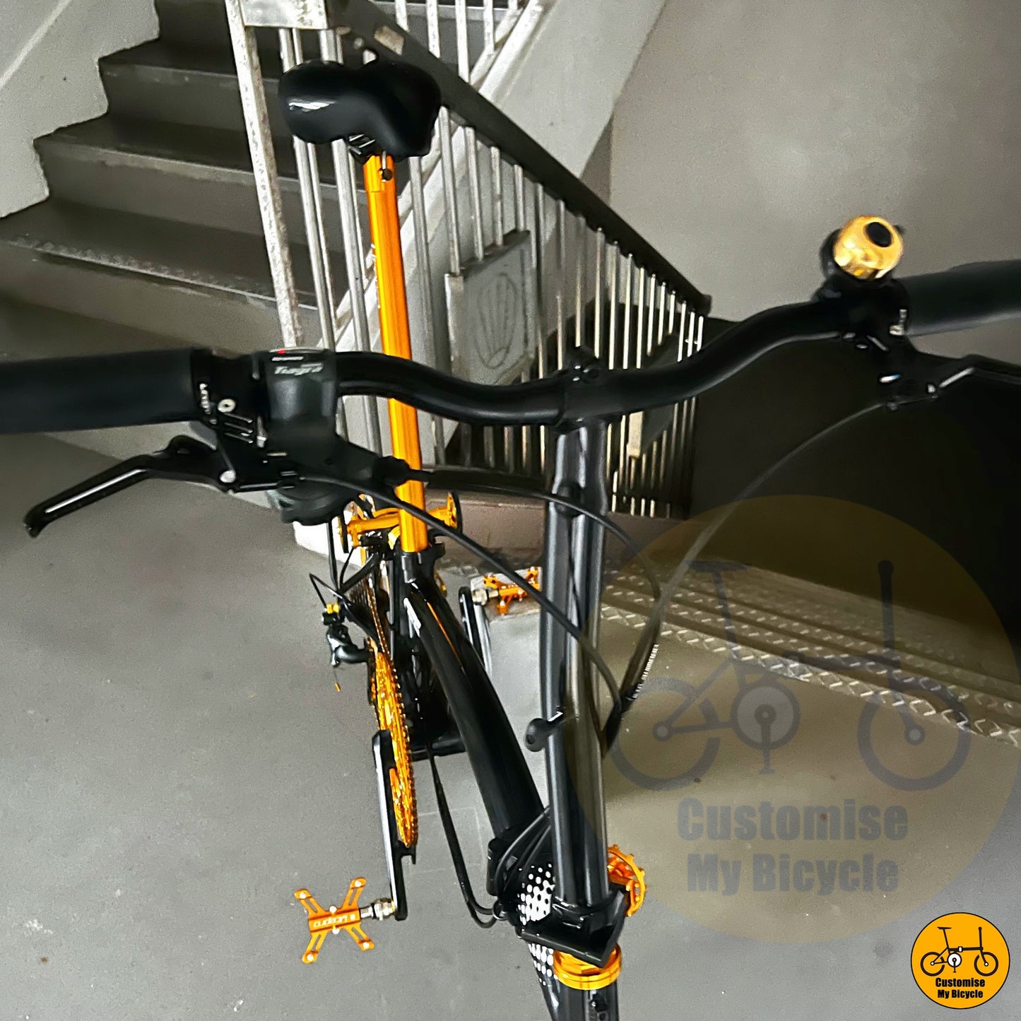 Black gold frame folding bike with ergonomic saddle and handlebars
