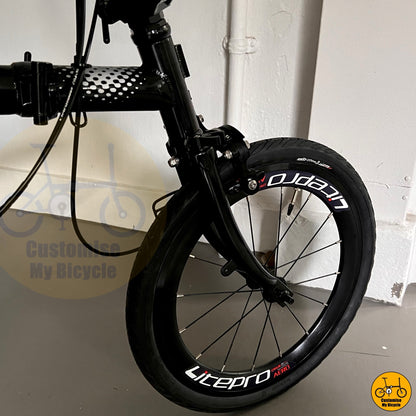 Close-up of rear derailleur and CST tyres on Crius Trifold
