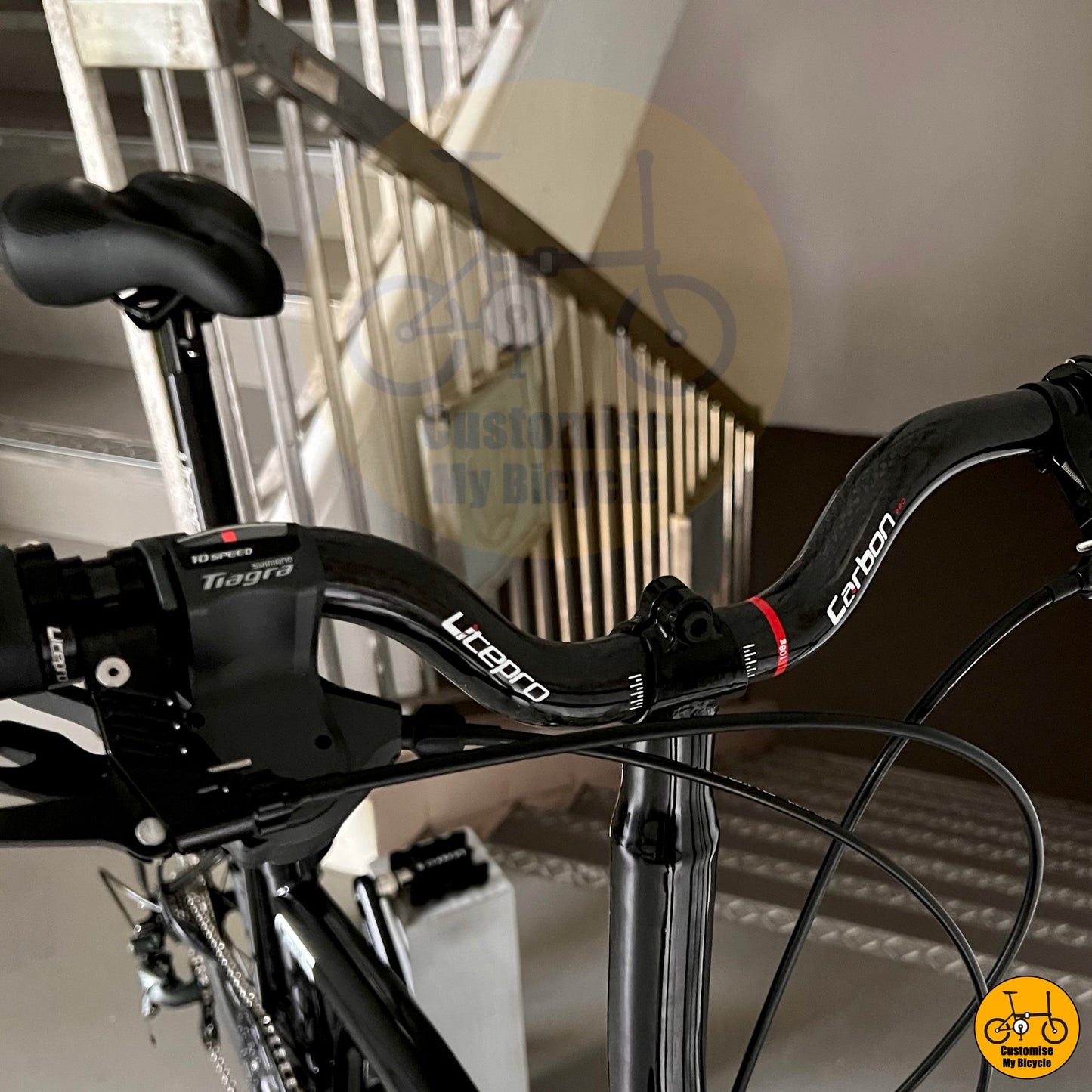 Litepro carbon riser bar on City-friendly Crius Trifold bicycle with black components
