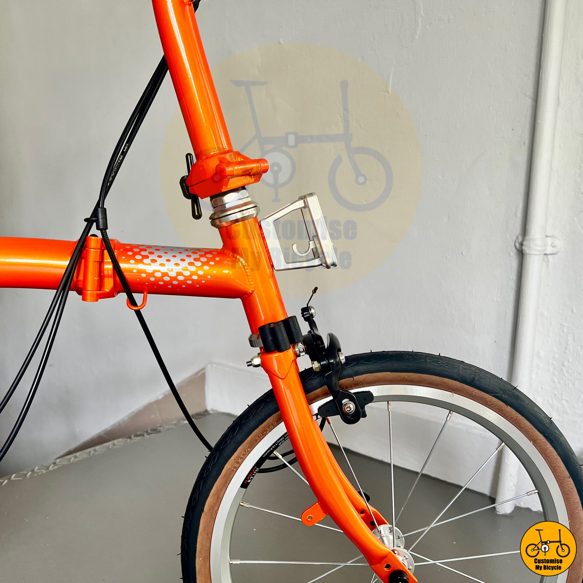 Crius Trifold 18-inch folding bike with sleek orange frame
