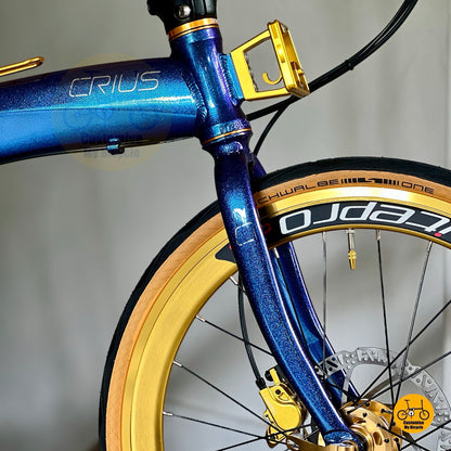 Crius Velocity folding bike in chameleon blue with gold accents
