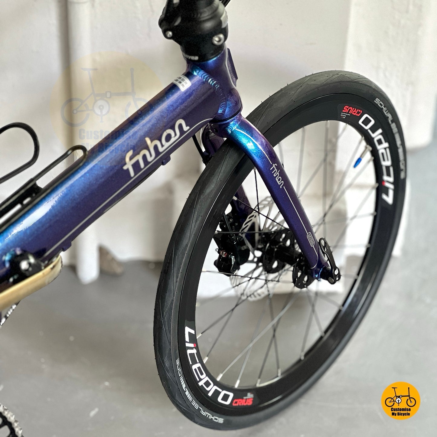 Close up of Litepro Aero high profile front wheel on Fnhon Blast Chameleon Blue folding bicycle
