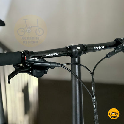 Litepro carbon straight bar and Meroca hydraulic disc brake close up detail
