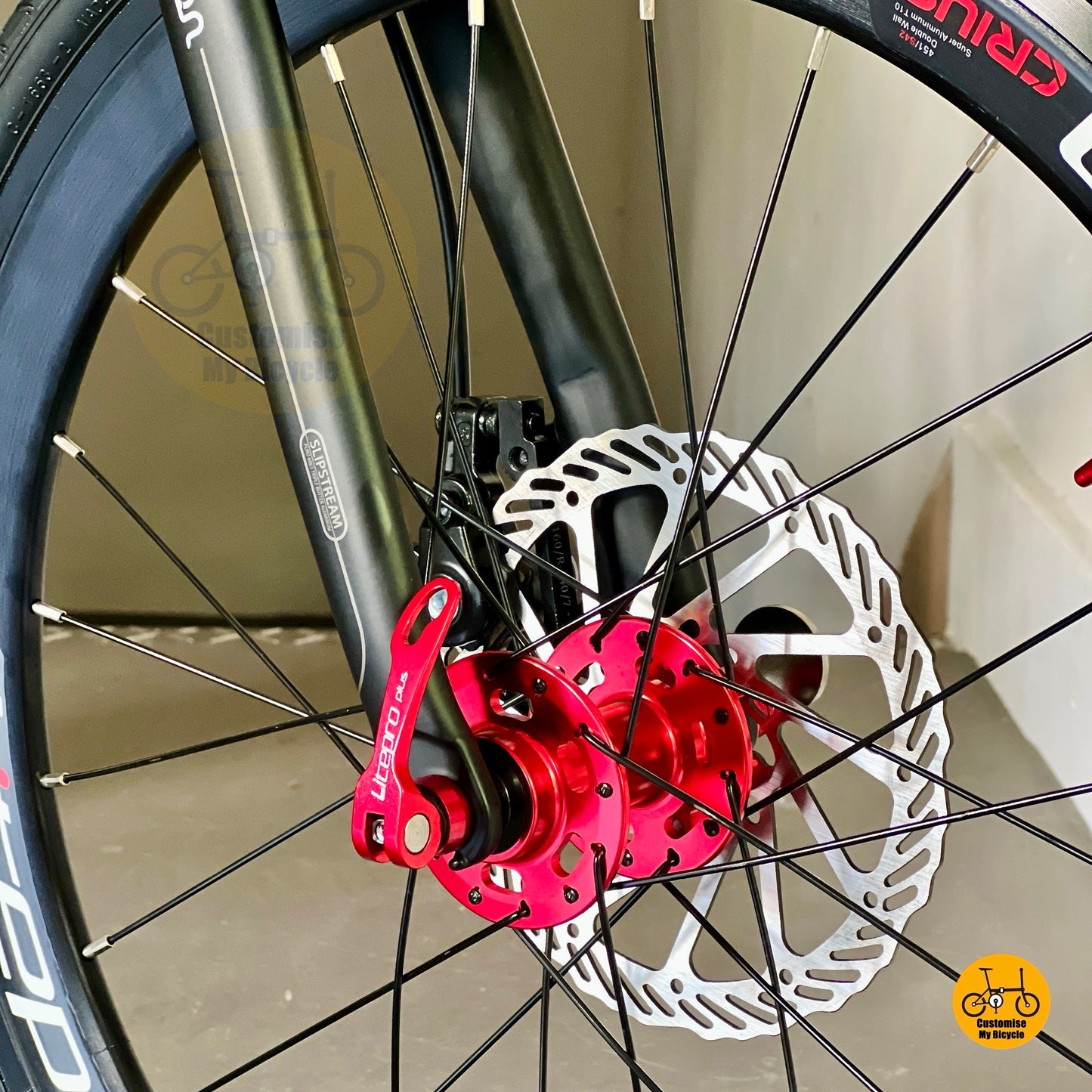 Close up of Litepro Aero front wheel on 22 inch folding bicycle