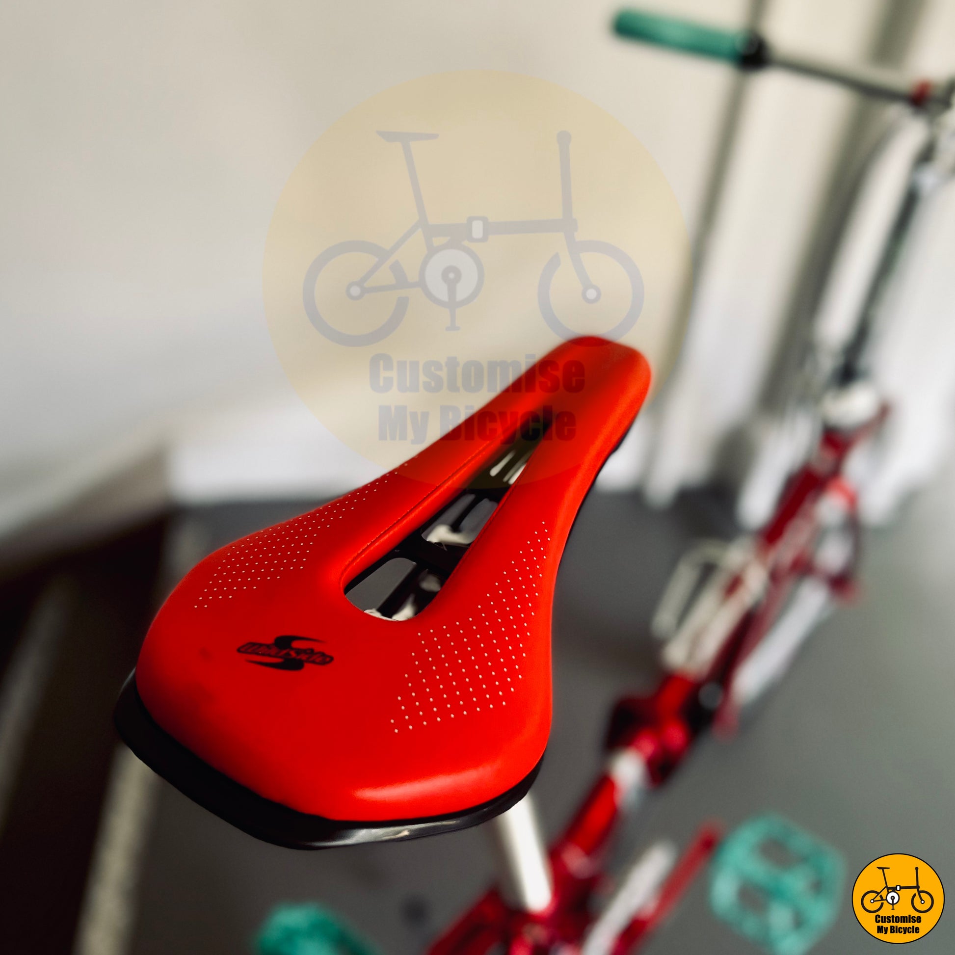 Red saddle on Fnhon Blast 22-Inch Folding Bike – Red & Silver Frame with Precision Bicycle Parts

