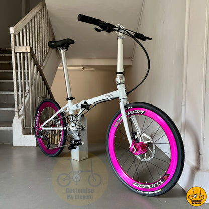 22-inch folding bike with white frame and pink rims
