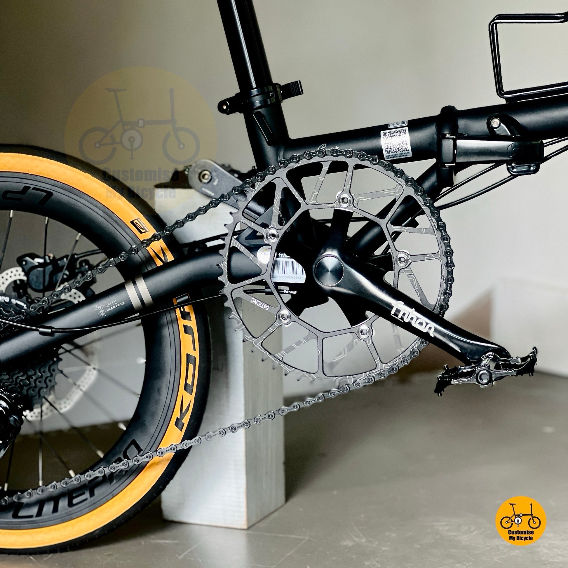 Folding bicycle stylish matte black frame tan wall tyres urban city bike
