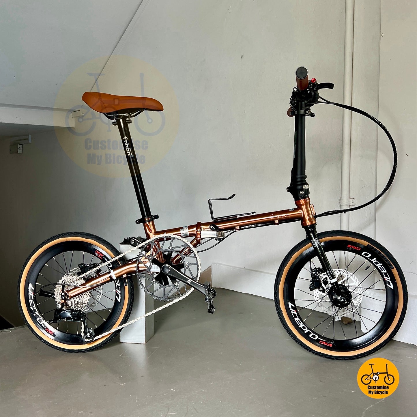 Full bike on display showing Fnhon Gust 18 inch Rose Gold colour tone, slim folding frame and elegant proportions