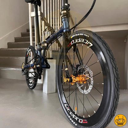 Sporty and modern folding bicycle with black aero rims
