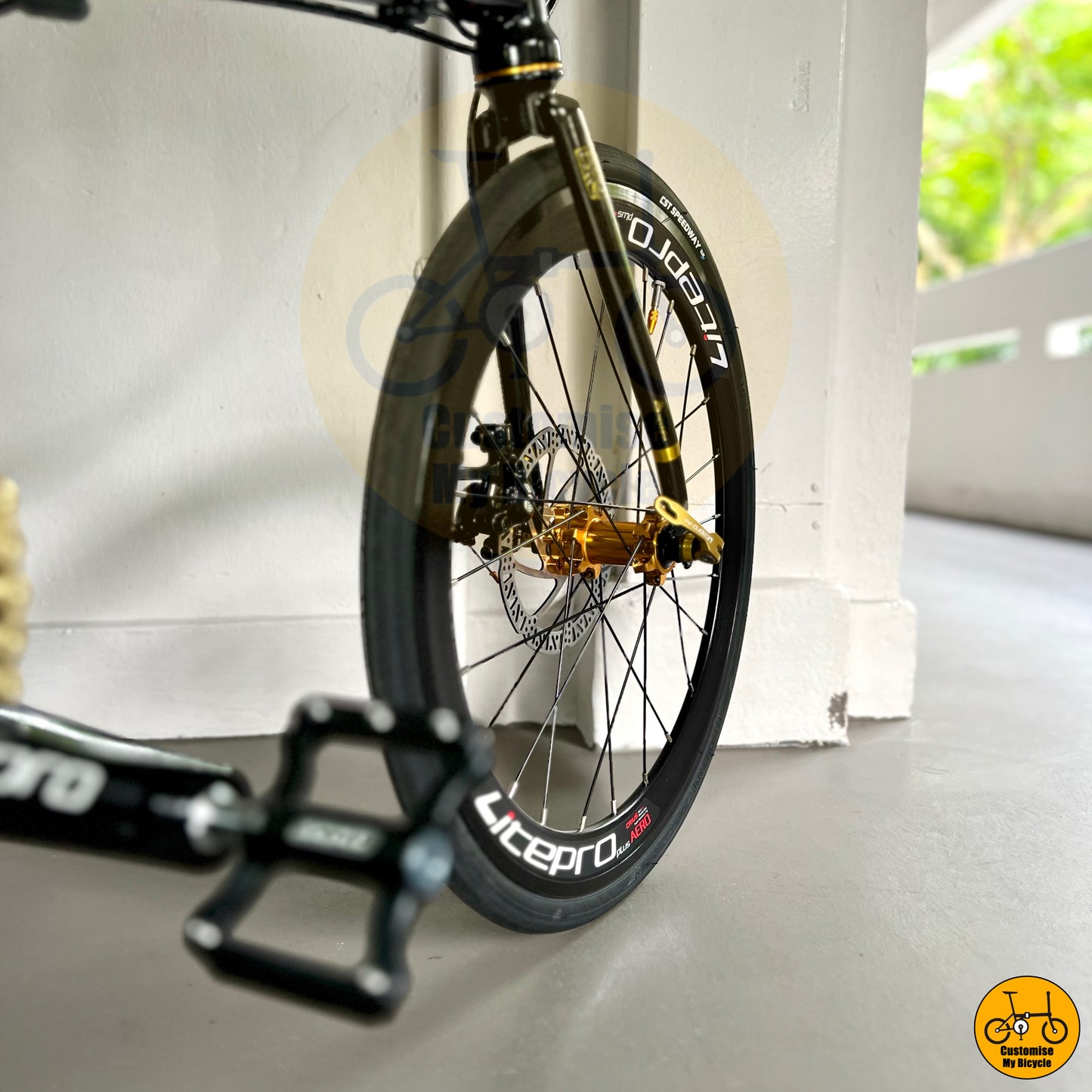 Litepro Aero black gold wheels on portable folding bike designed for city commuting and storage convenience
