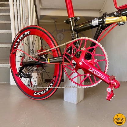 Premium black gold frame foldie with a striking red seatpost and handlebars
