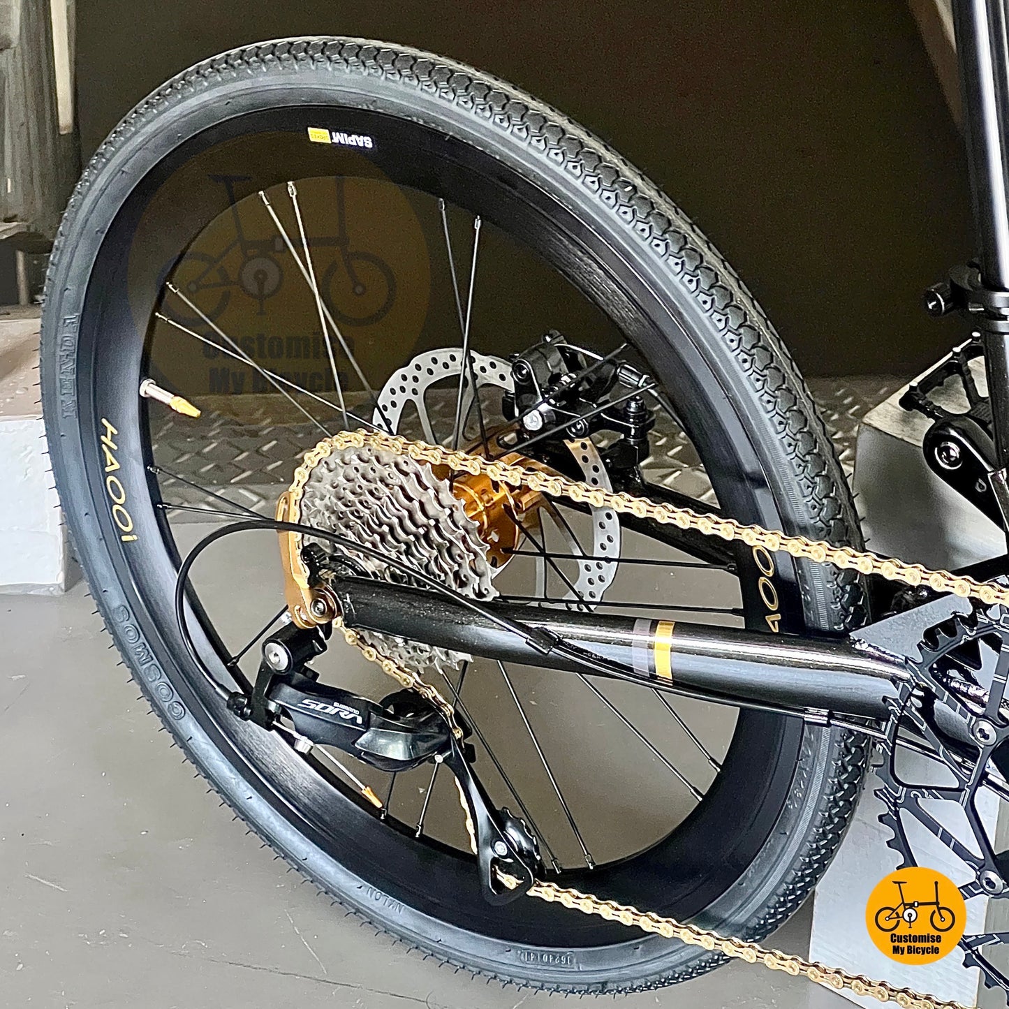 Foldable 22” bike with gold accent tips
