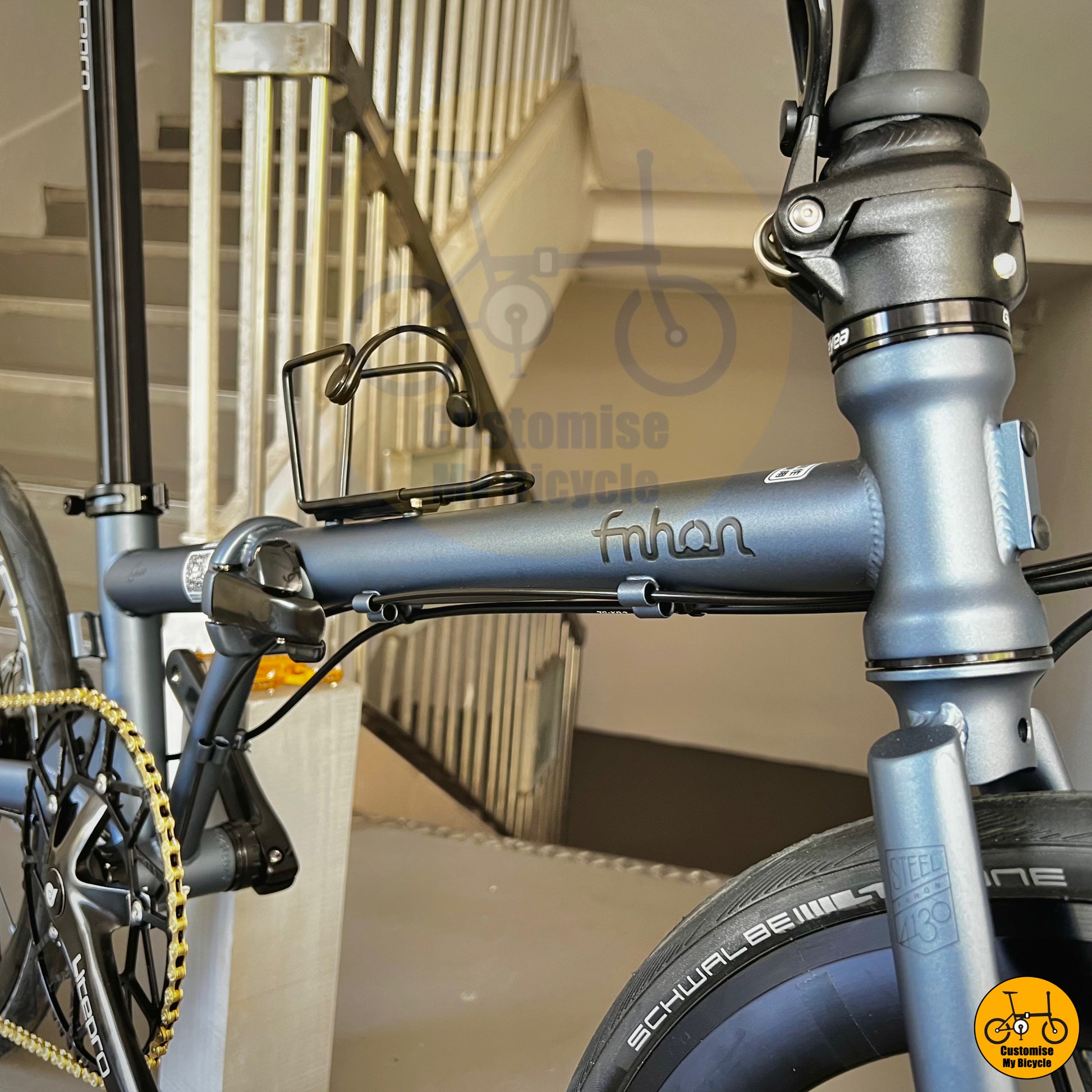 Sleek battleship grey foldie featuring gold pedals for a premium finish
