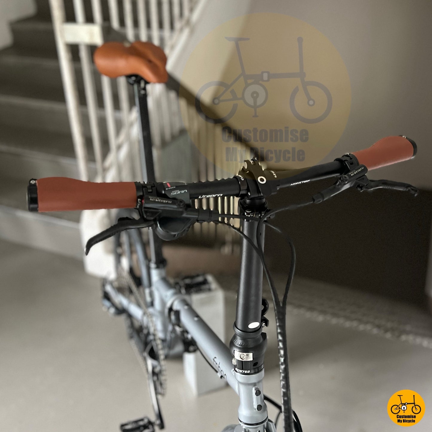 Custom-built folding bicycle with aerodynamic wheels and black crank
