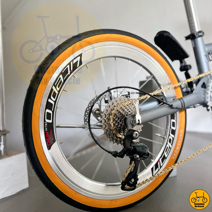 Foldable bicycle in matte Battleship Grey with retro chrome accents and comfy posture geometry  
