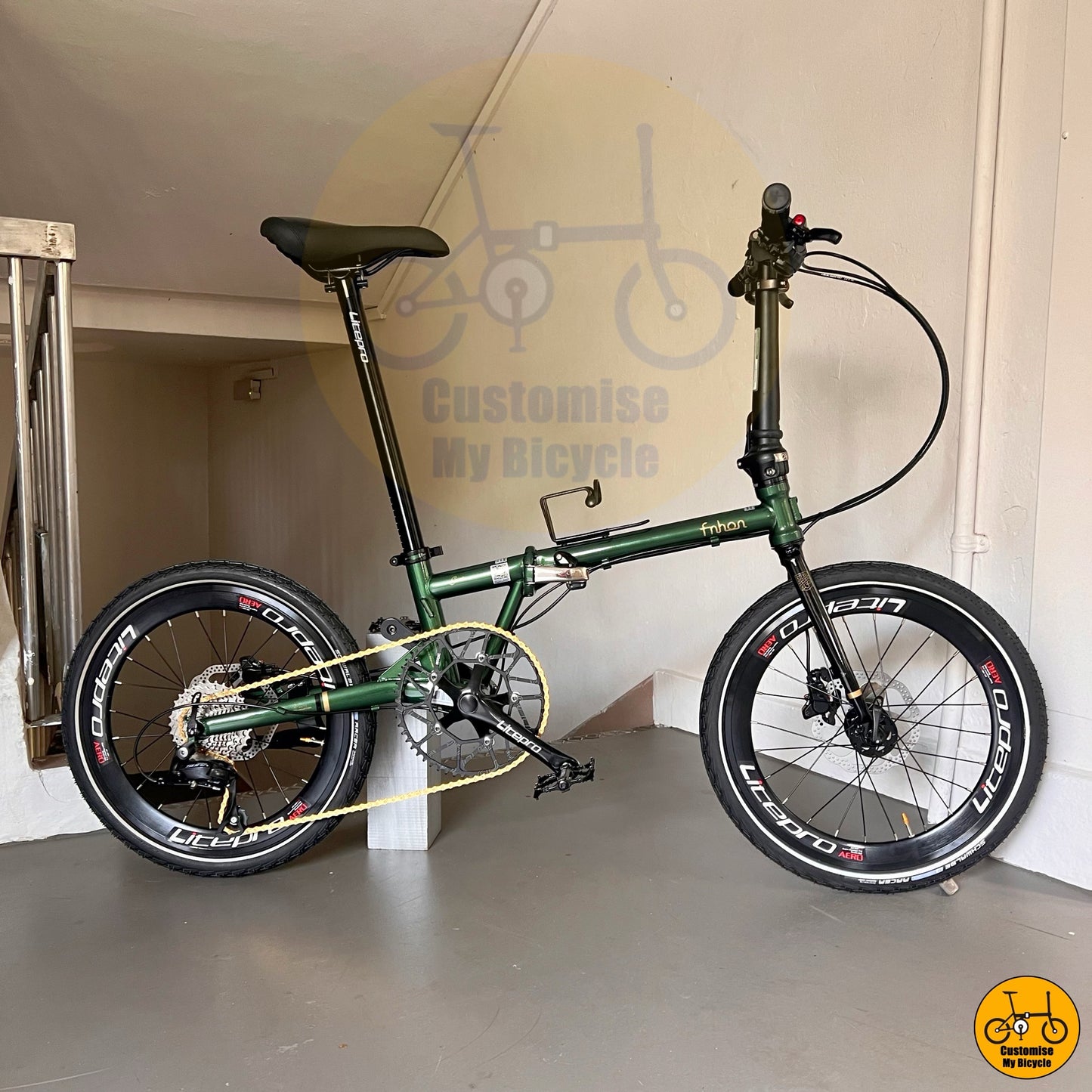 Emerald green foldable bicycle with round bar and hydraulic brakes for PCN and road  
