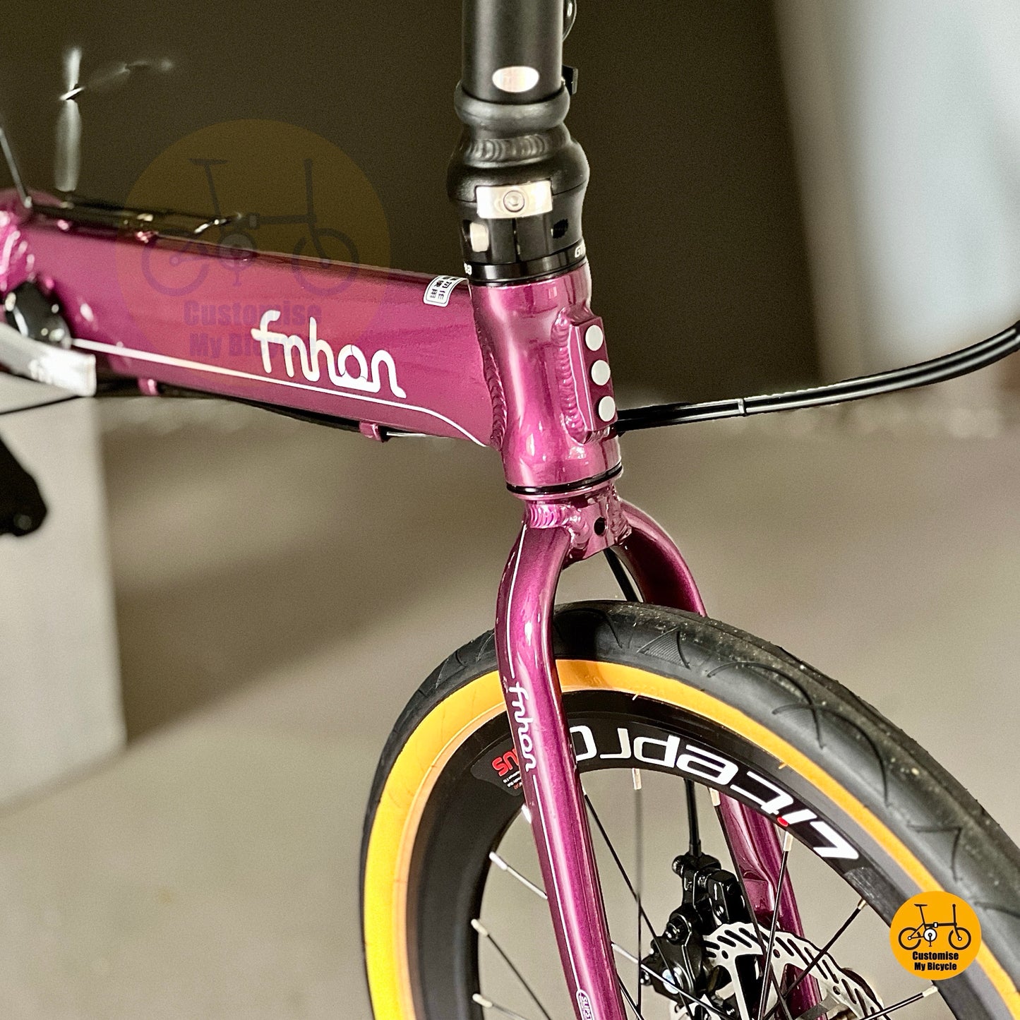 Detail shot of Fnhon Blast Royale Purple folding bicycle showing comfy saddle and adjustable seatpost