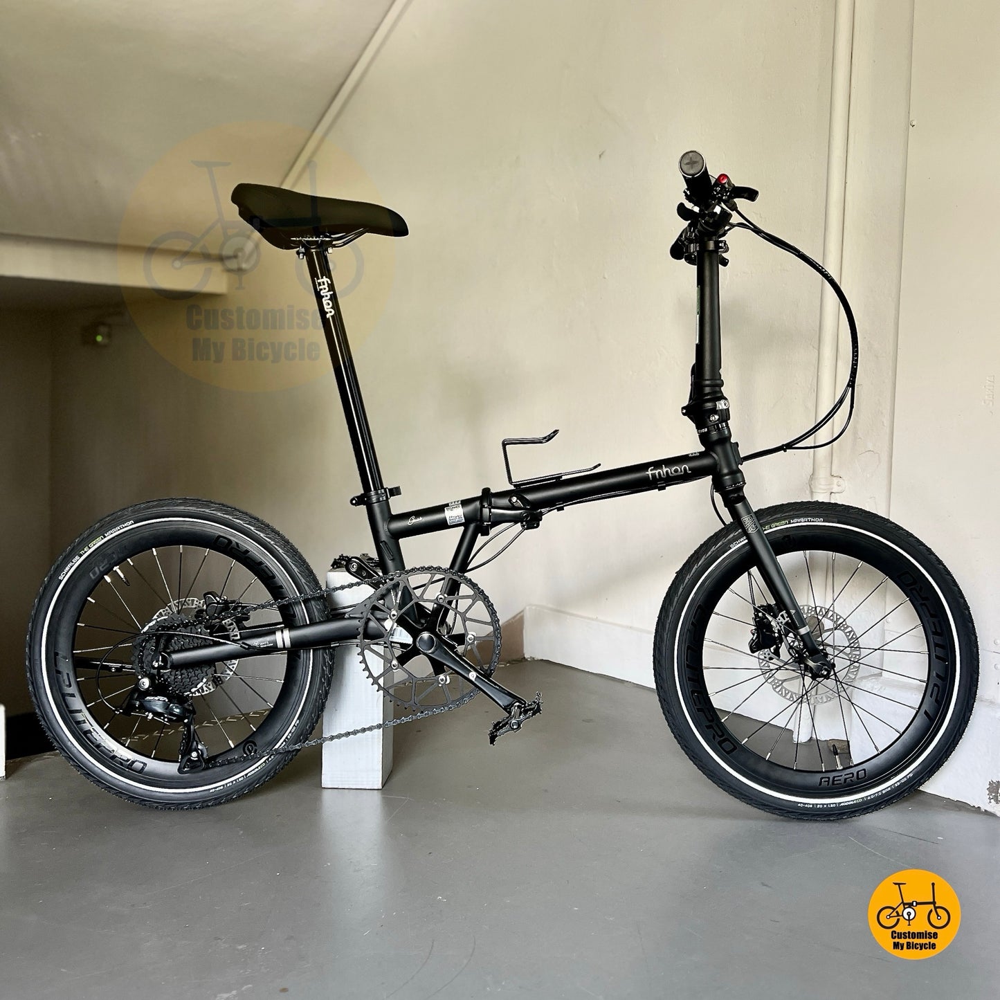 Matte black foldable bicycle with Litepro crank hydraulic brakes and high profile aero wheels  
