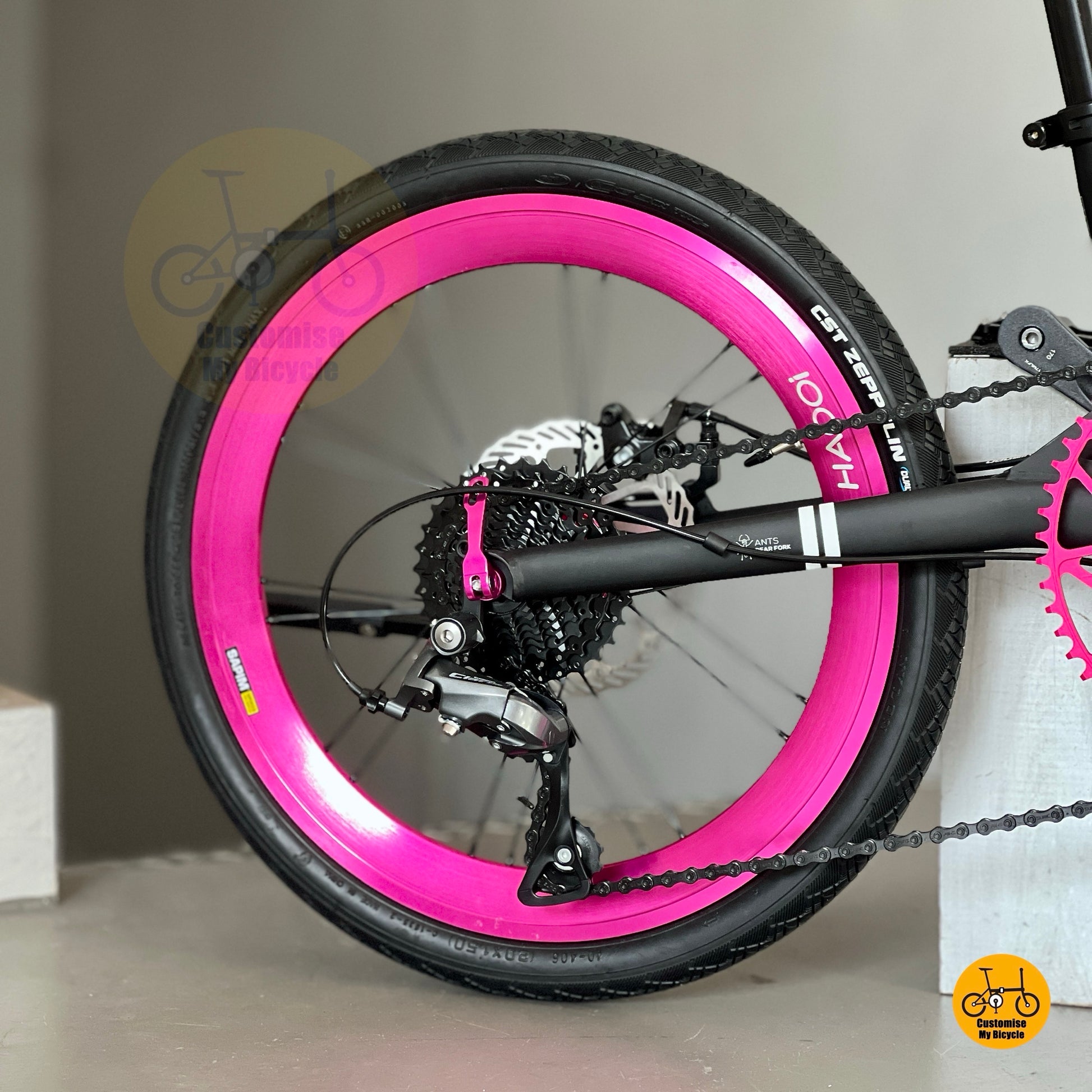 Close-up of Shimano 9-speed rear derailleur and Shimano black cassette 11-32t on Fnhon Gust 20-inch black frame
