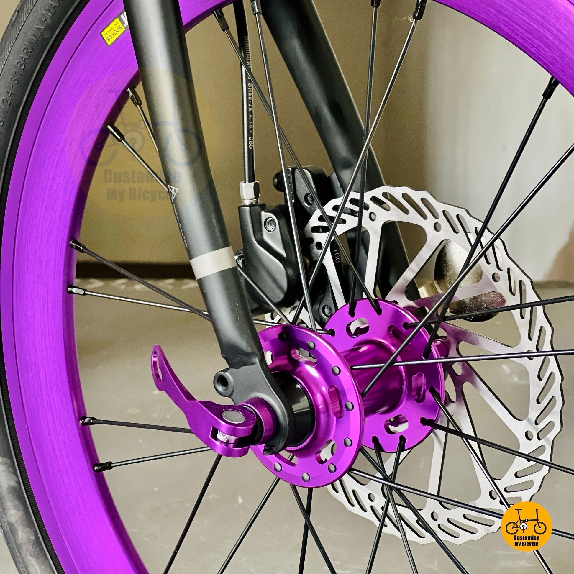 Close up of HAOOI Max front wheel and CST City tyre on folding bicycle