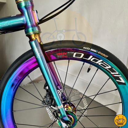 CST Speedway 451 tyres on ergonomic folding bike with a sturdy oil slick frame for smooth rides
