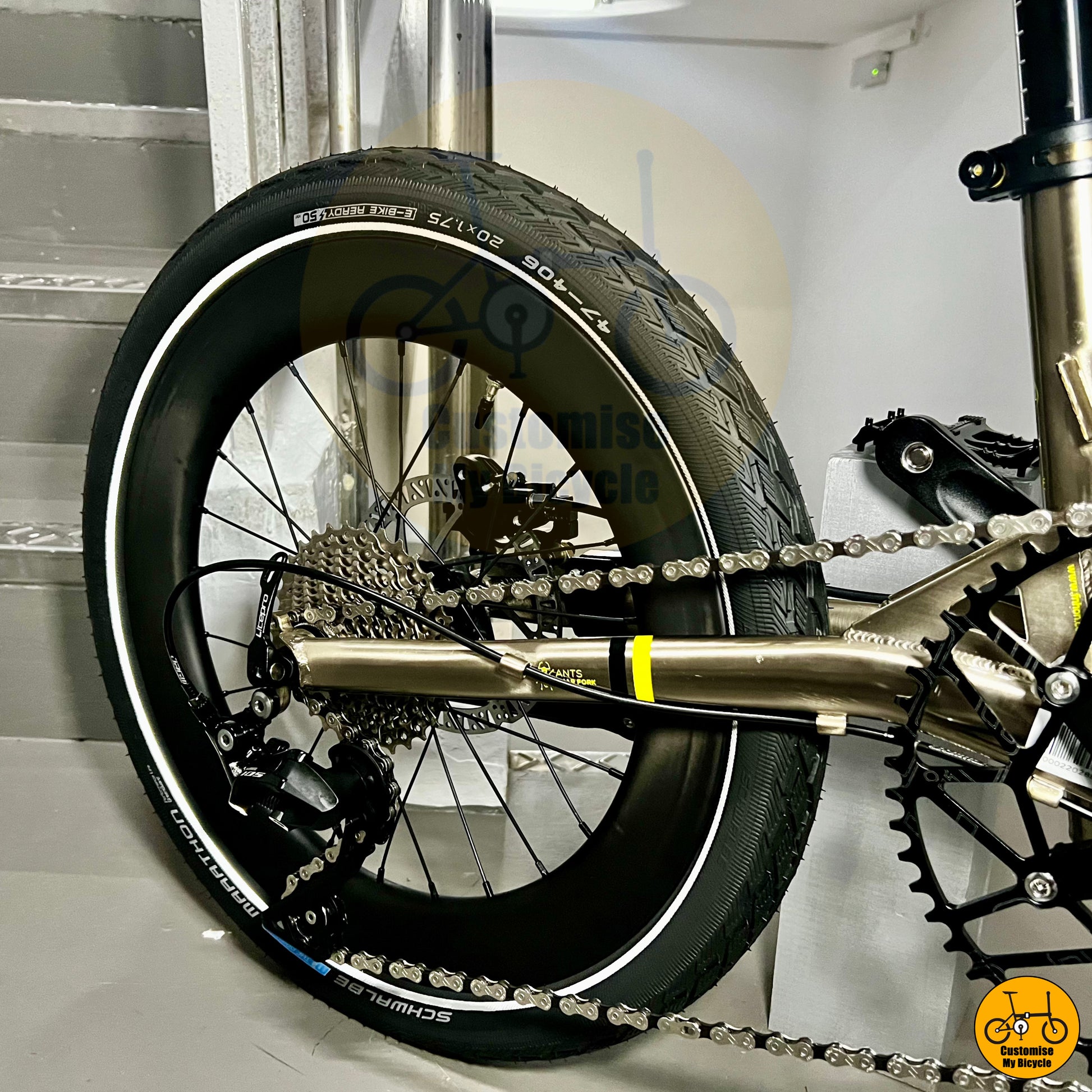 Folding bike with a titanium gold frame and high-quality Shimano 11 speeds 105 transmission system
