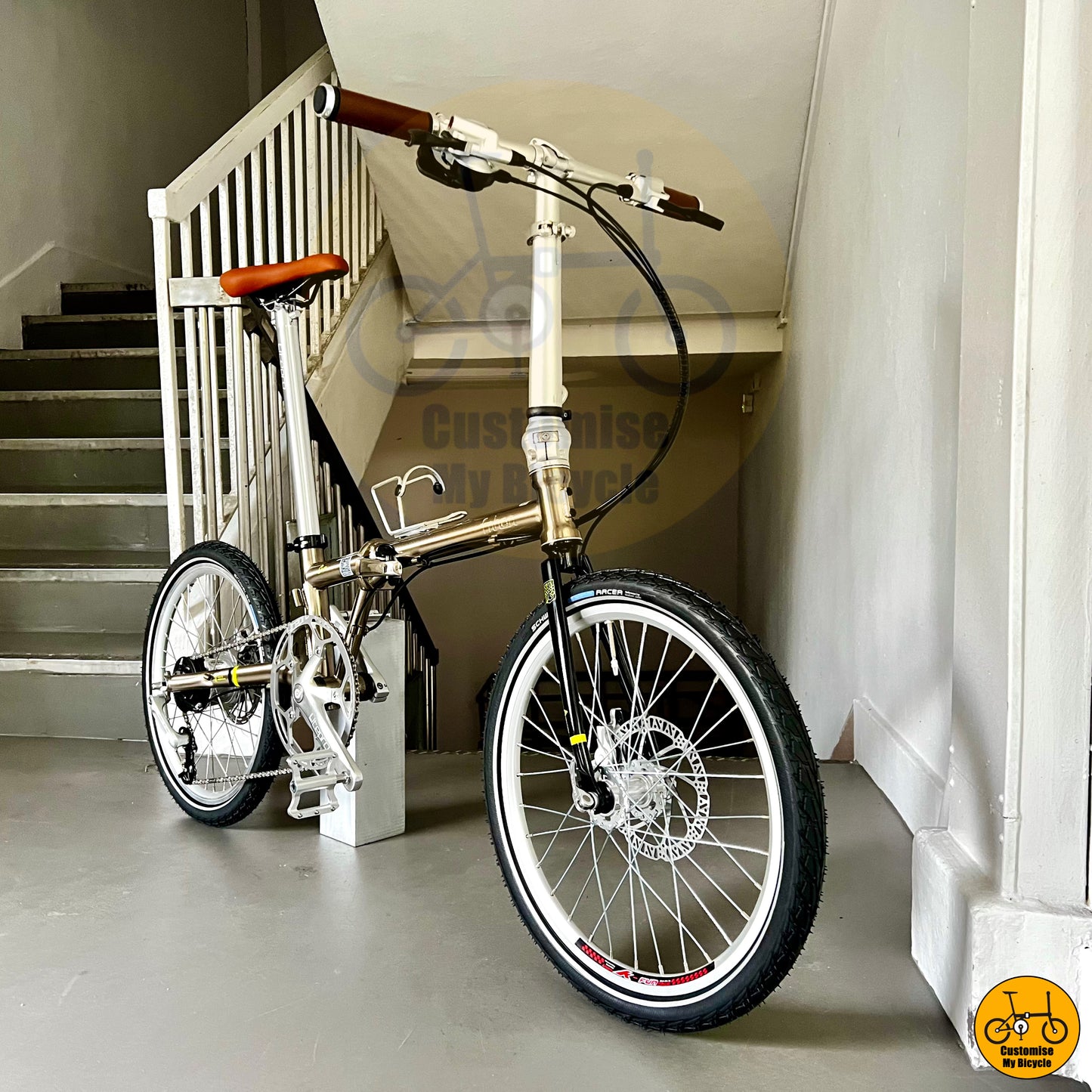 Titanium gold foldable bike designed for efficient city commuting and touring
