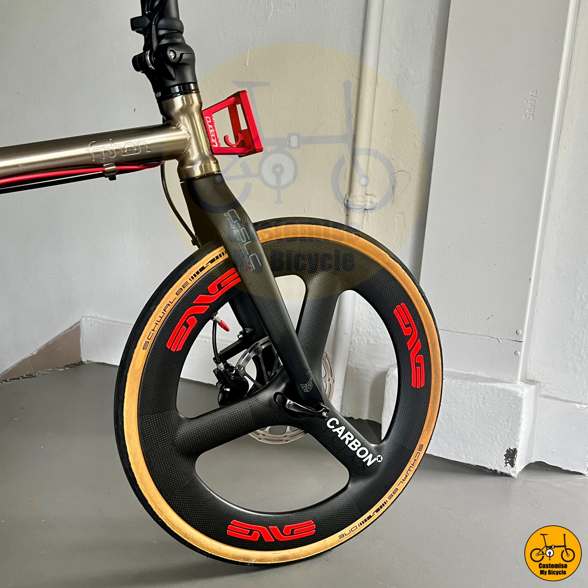 Titanium gold Fnhon Gust 20-inch folding bike with Carbonician Trispokes wheels
