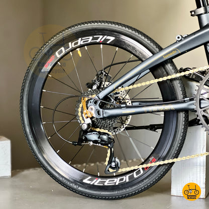 Shimano 9 speed folding bike with gold trim  
