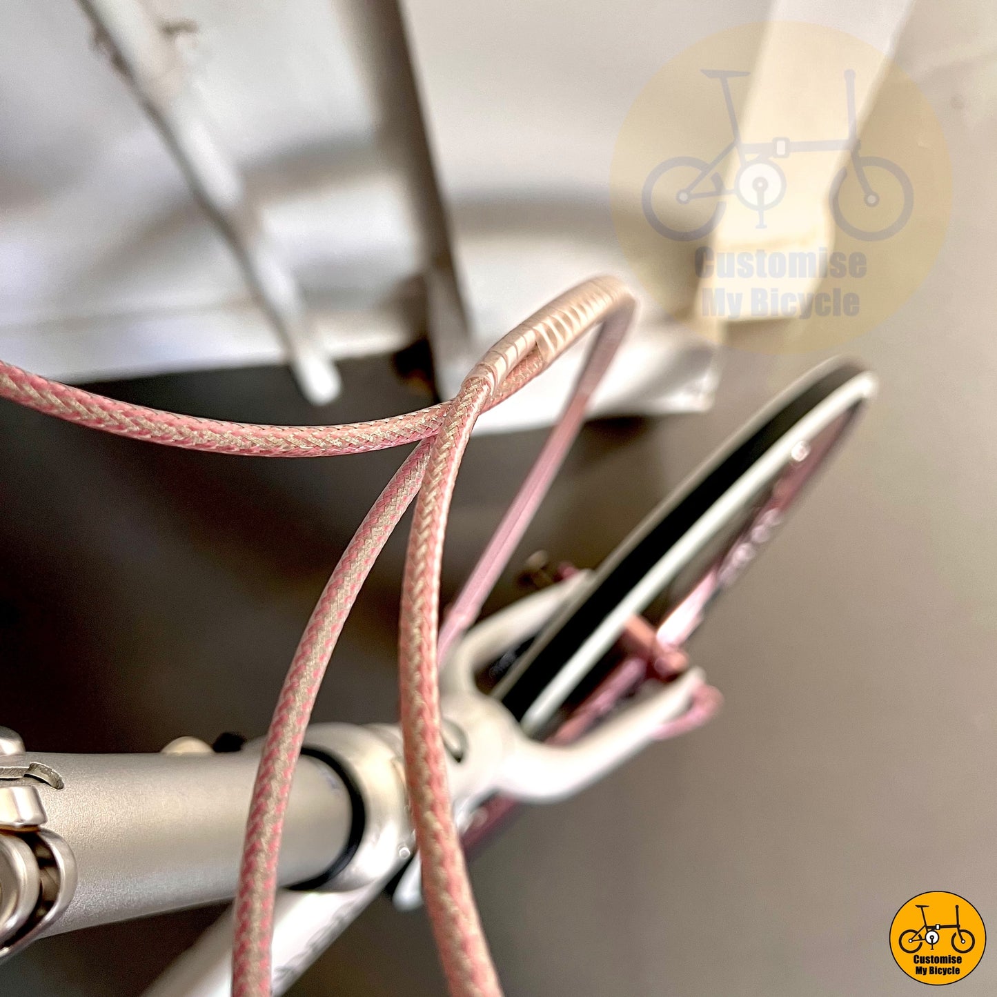 Pink Cable Hoses on Dreamy White Foldable Bicycle – Smooth, Sleek & Comfortable
