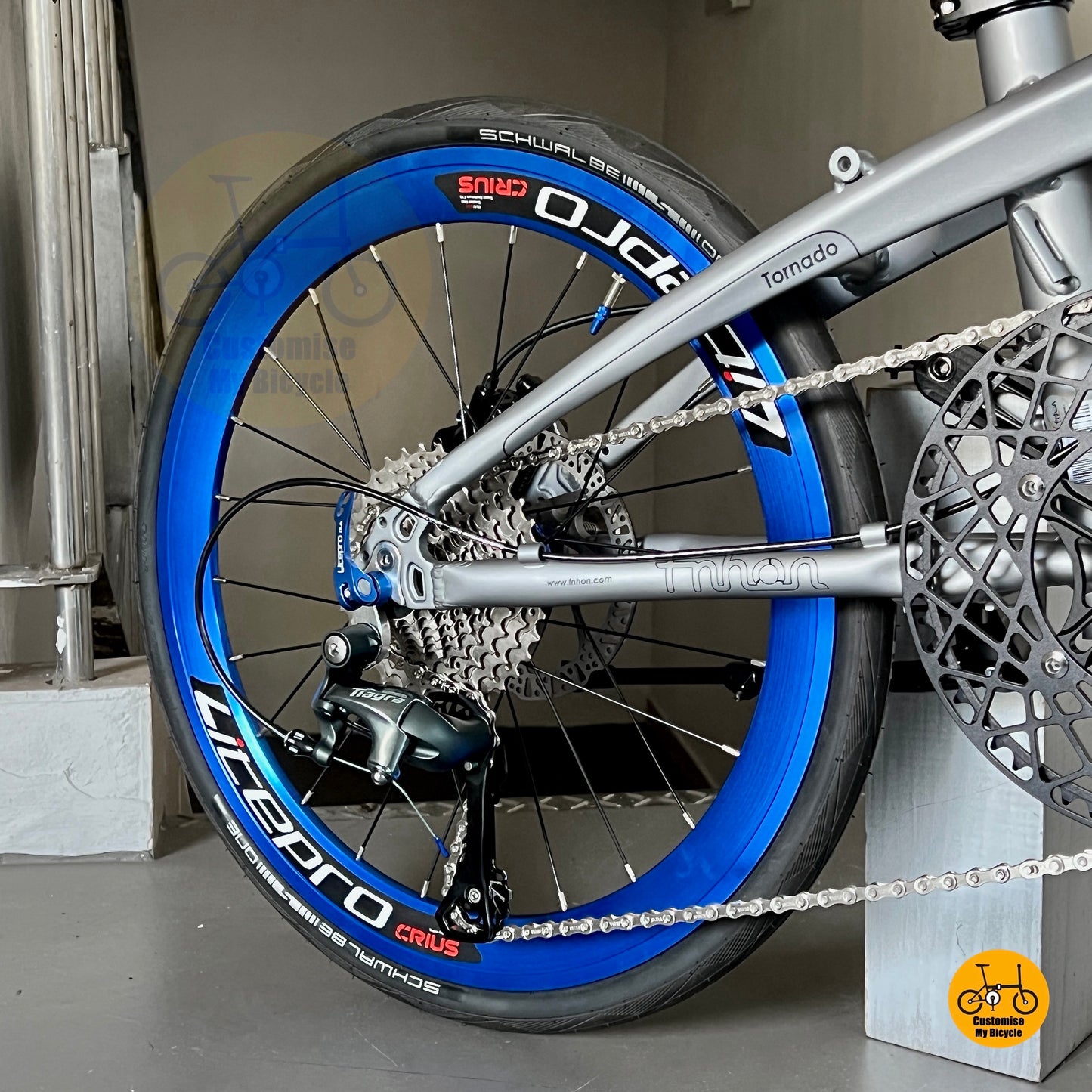 Detail shot of Schwalbe One fast tyres on Fnhon Tornado 22 inch folding bike Battleship Grey
