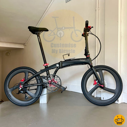 Matte black and red colour theme on city-ready foldable performance bike
