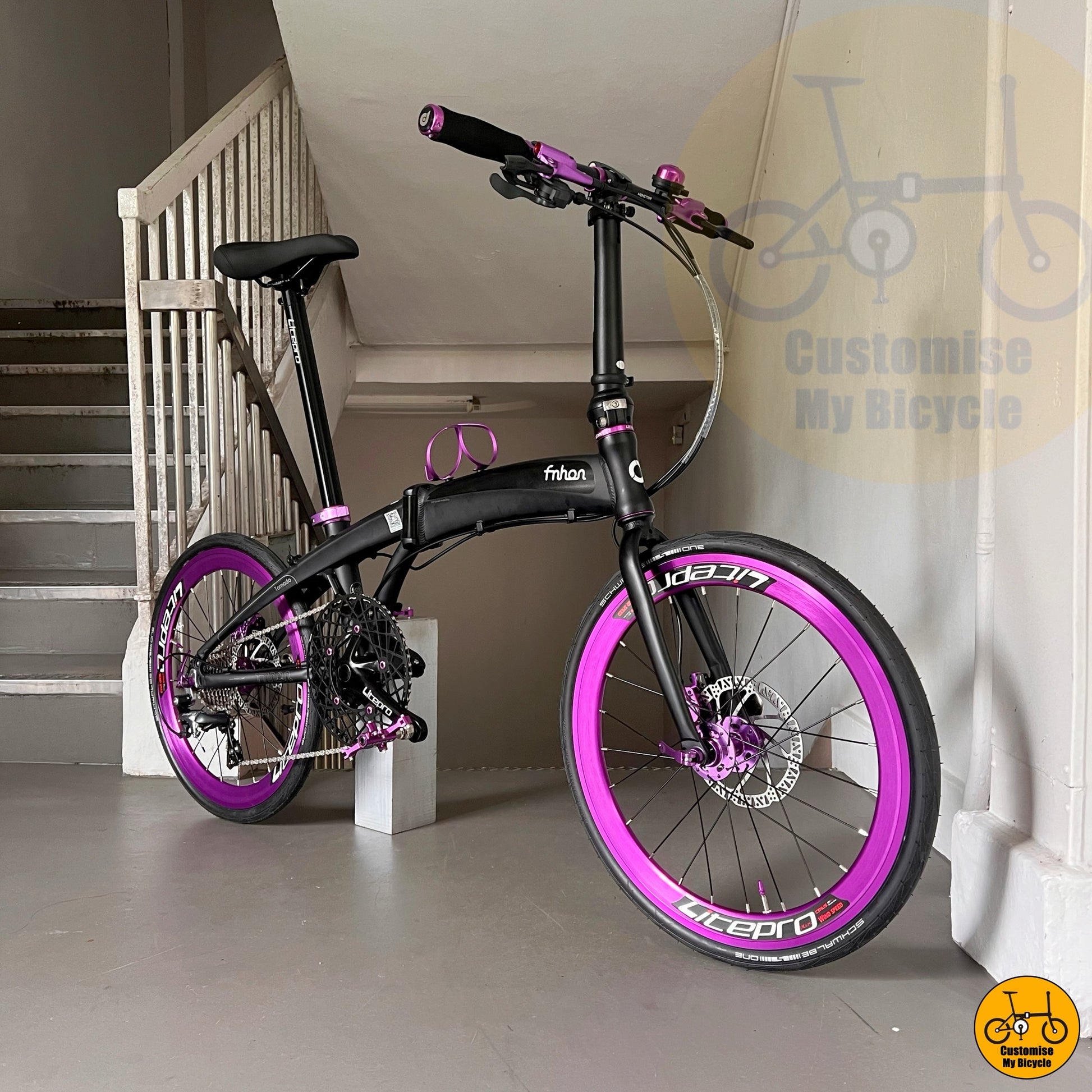 Fnhon Tornado 22-inch Matte Black Folding Bike with Violet Accents for Stylish City Riders
