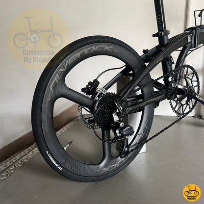 black Shimano cassette on compact foldable bike
