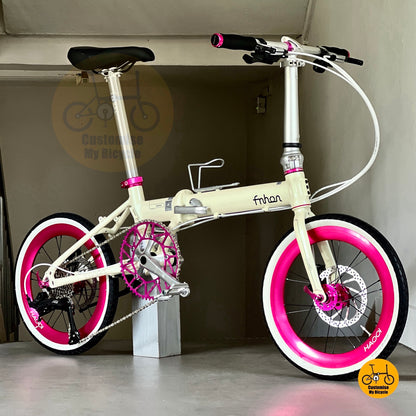 Compact folding bike for women and girls with white tyres and pastel tones  
