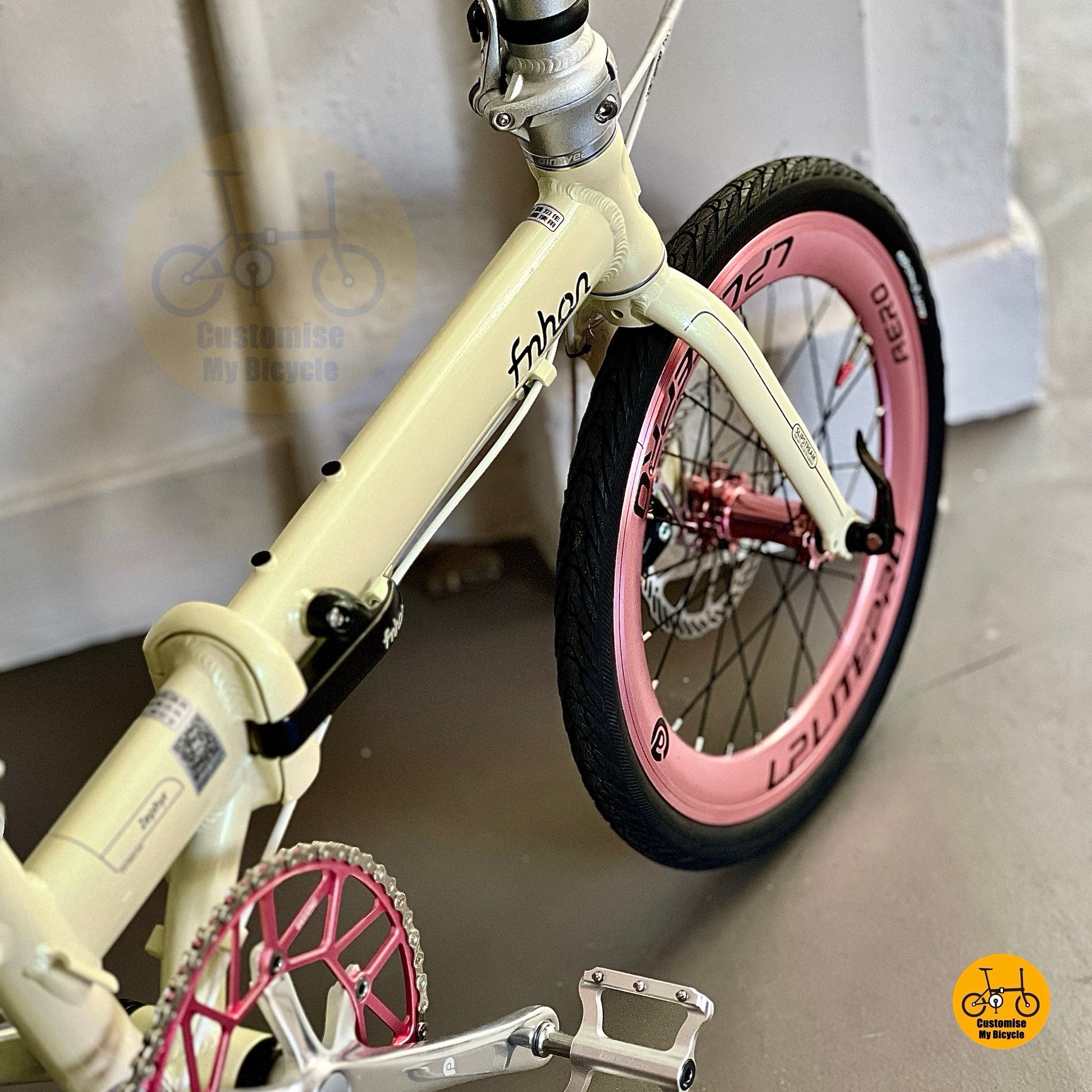 Close up of Litepro aero front wheels on Fnhon Zephyr beige foldable bike
