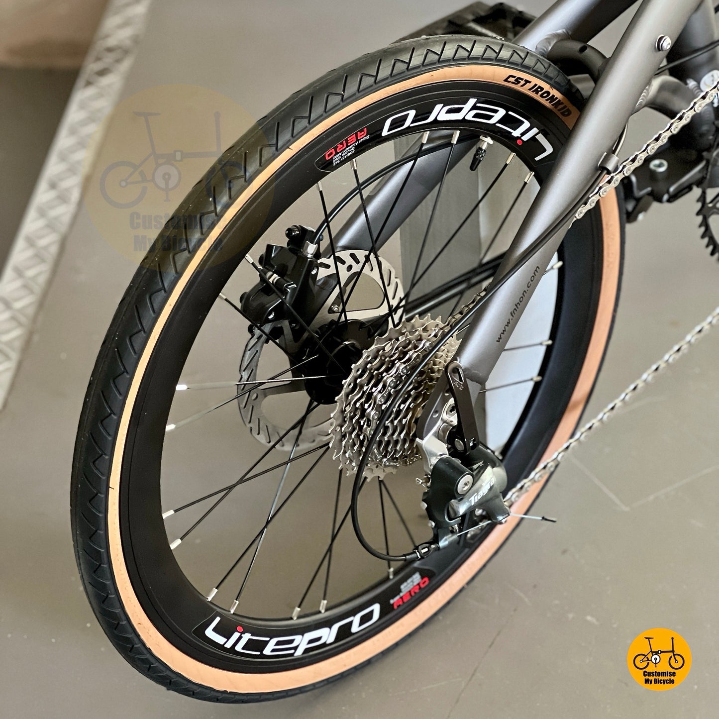 Rear derailleur and gear system close up of Shimano Tiagra 10 Speed on Fnhon Wind folding bike  
