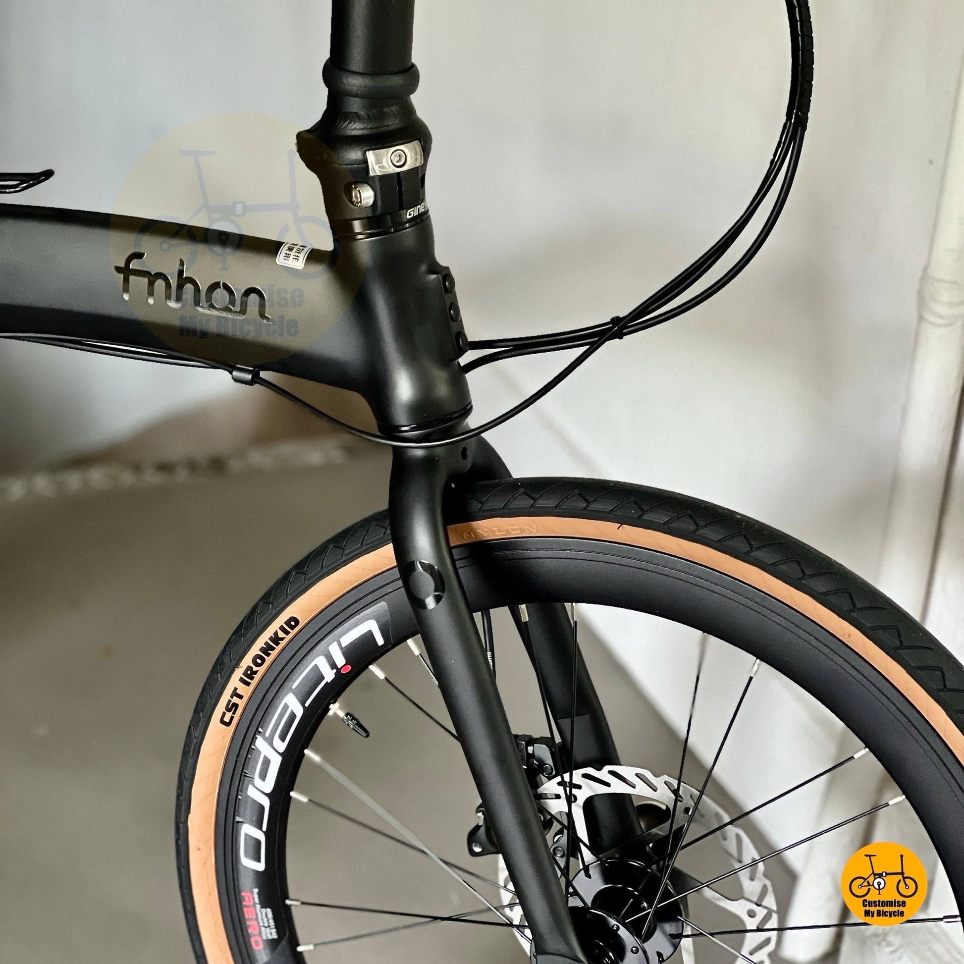 Higher front view of Fnhon Wind folding bike showcasing seamless welding matte black frame
