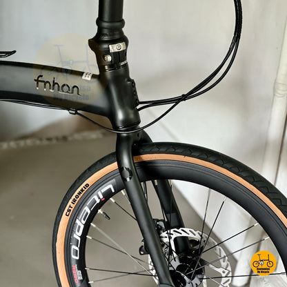 Higher front view of Fnhon Wind folding bike showcasing seamless welding matte black frame
