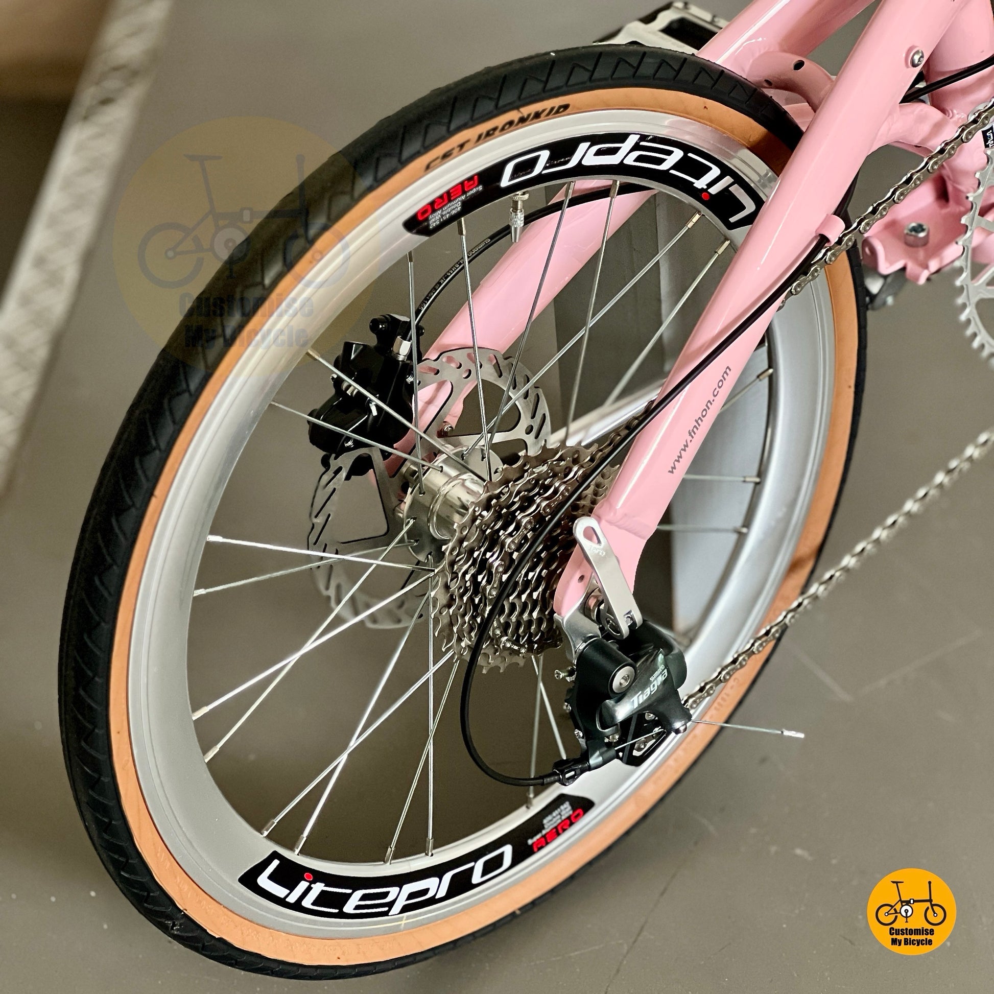 Rear gear system close up of Shimano Tiagra 10 Speed on Fnhon Wind Baby Pink foldie